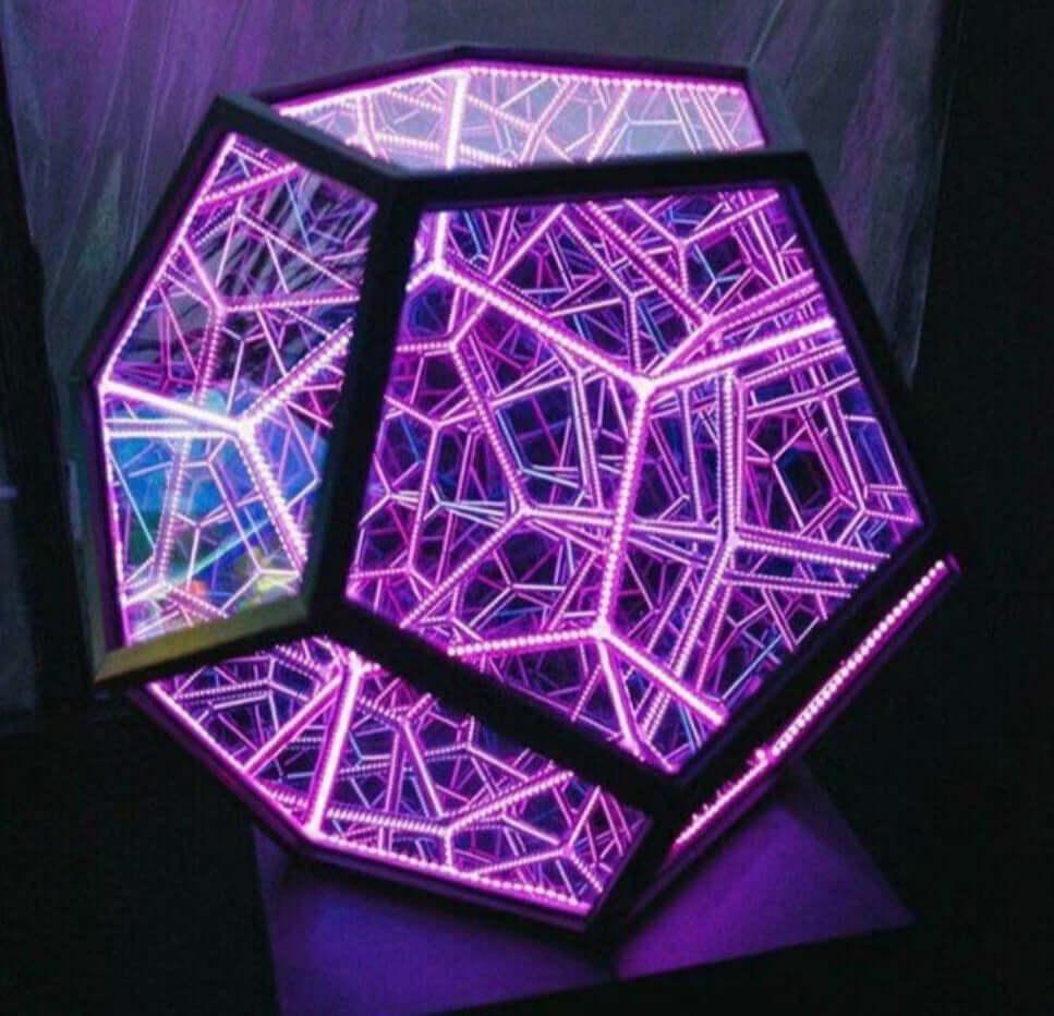 Colorful dodecahedron lamp with vibrant LED lights in geometric design, perfect for modern home decor.
